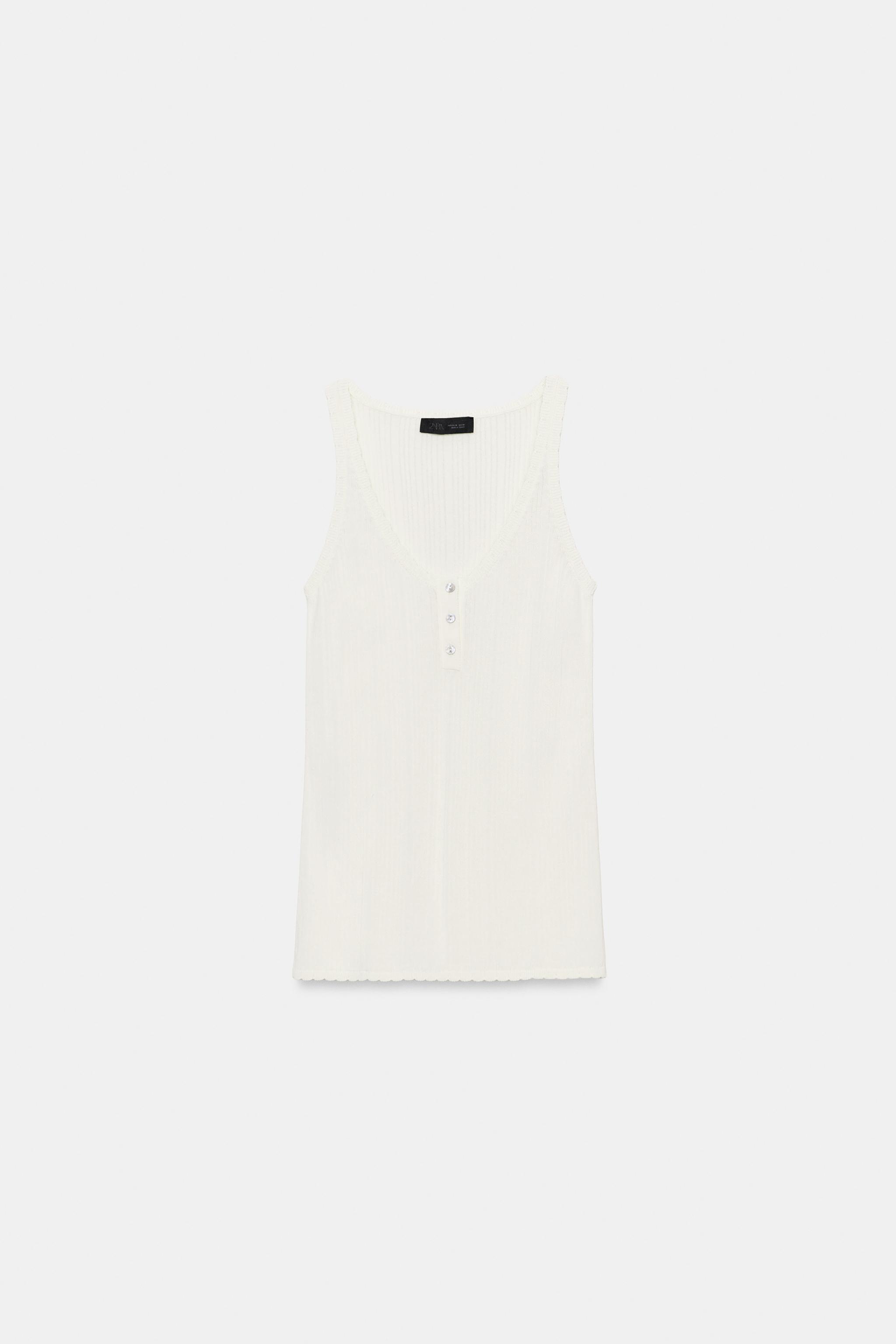 TOP EN MAILLE À DÉCOLLETÉ ROND